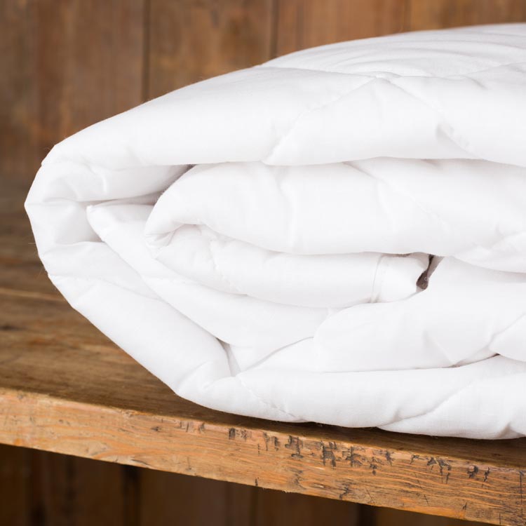 white cotton quilted mattress protector